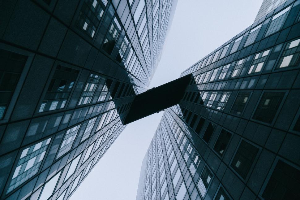Free Image of Modern skyscrapers with a sky bridge in clear sky. 
