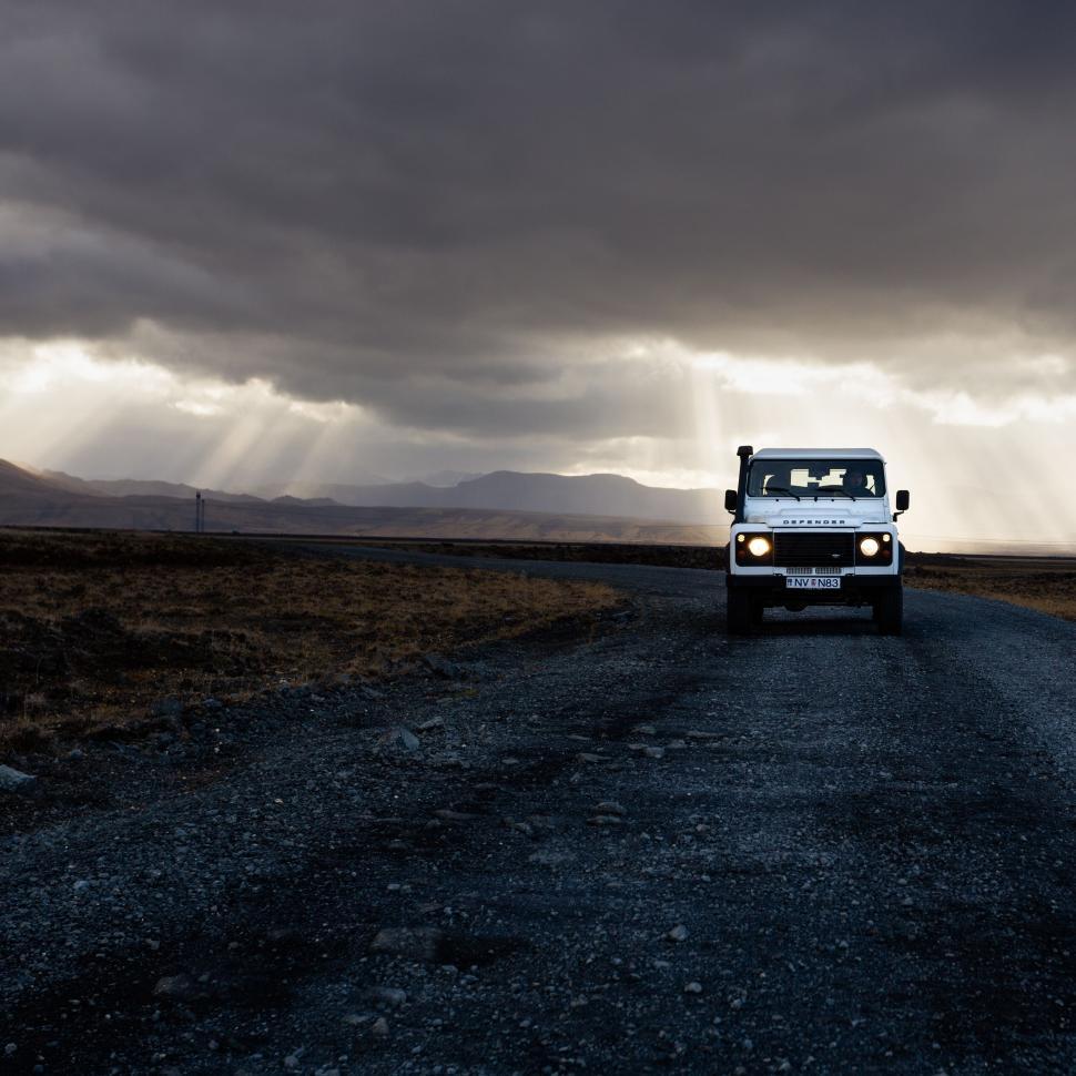 Free Image of Four-wheel drive vehicle on remote mountain road 