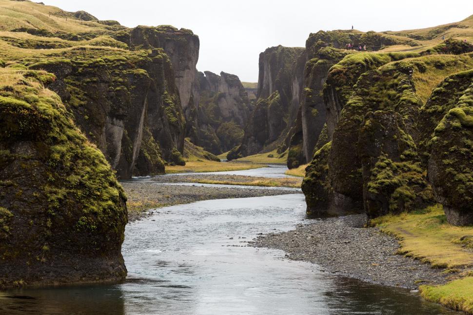 Free Image of A beautiful, narrow canyon with a winding river in it. 