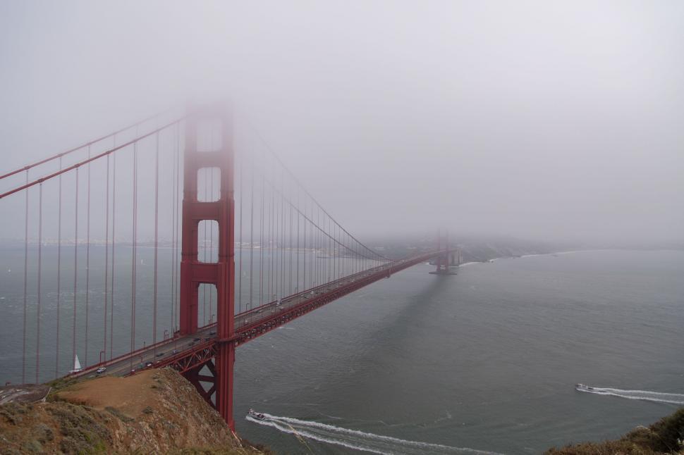 Free Image of Golden Gate Bridge shrouded in fog over San Francisco Bay 