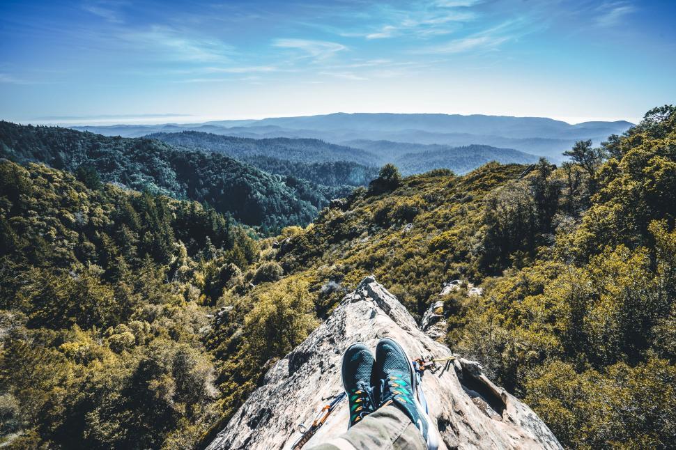 Free Image of Relaxing on a mountaintop, enjoying breathtaking views. 