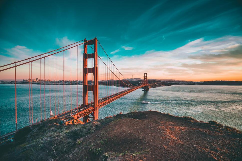 Free Image of Golden Gate Bridge during sunrise with vibrant sky 