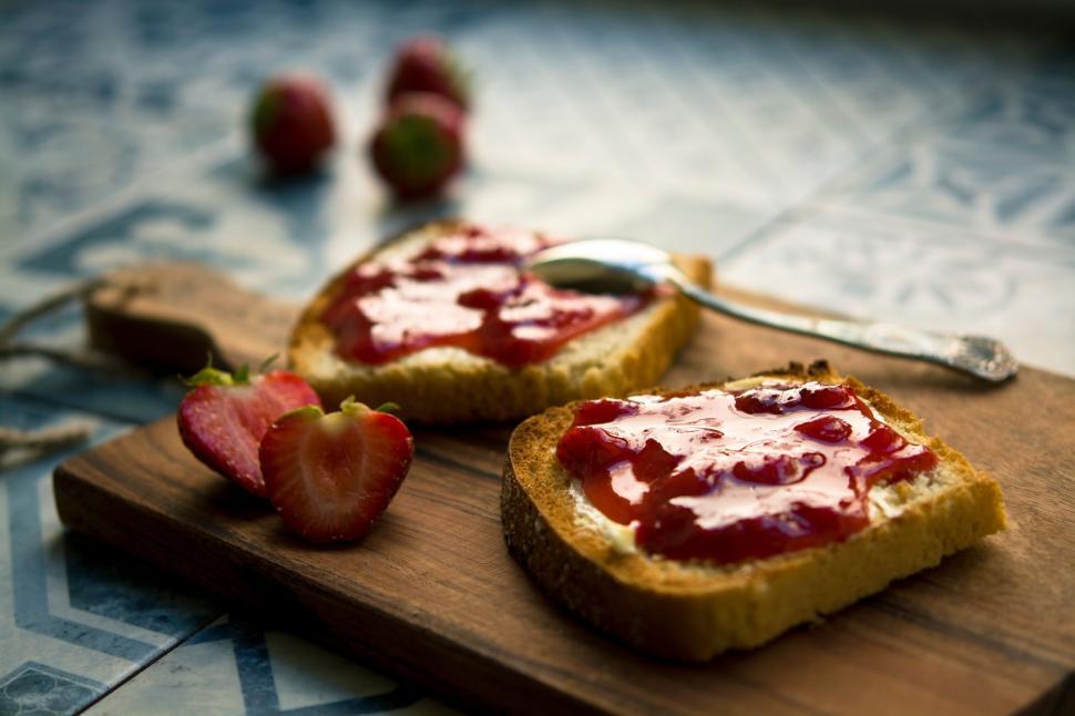 Free Image of Toast with strawberry jam and fresh strawberries. 