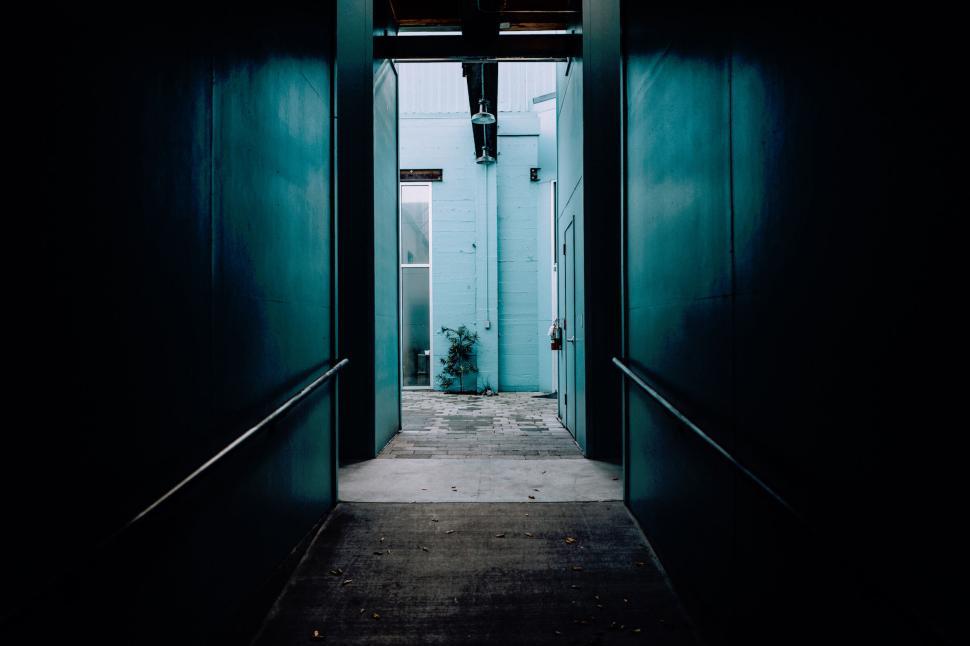 Free Image of Modern minimalist corridor leading to an outdoor area 