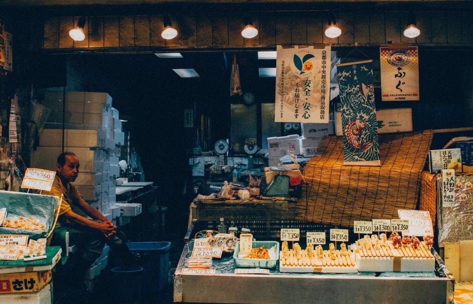 Free Image of Japanese seafood market stall with various fishes and goods. 