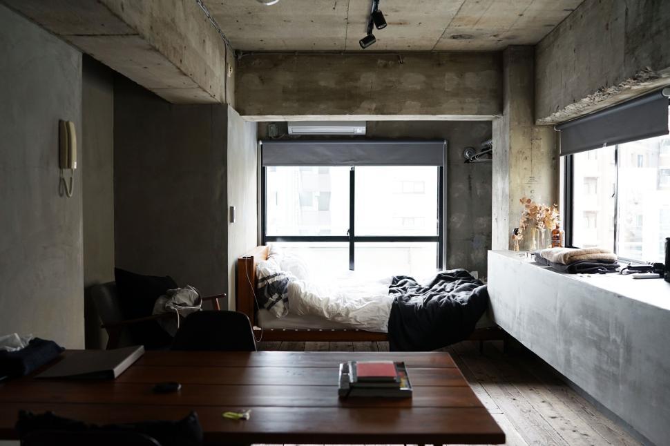 Free Image of Minimalistic urban bedroom with large window and bed 