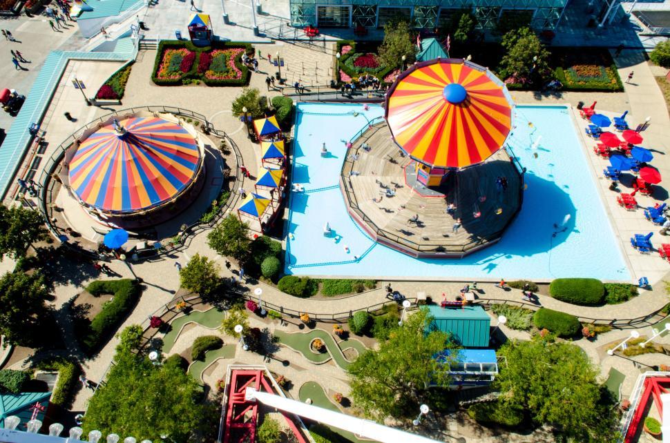 Free Image of Colorful amusement park rides with vibrant umbrellas 