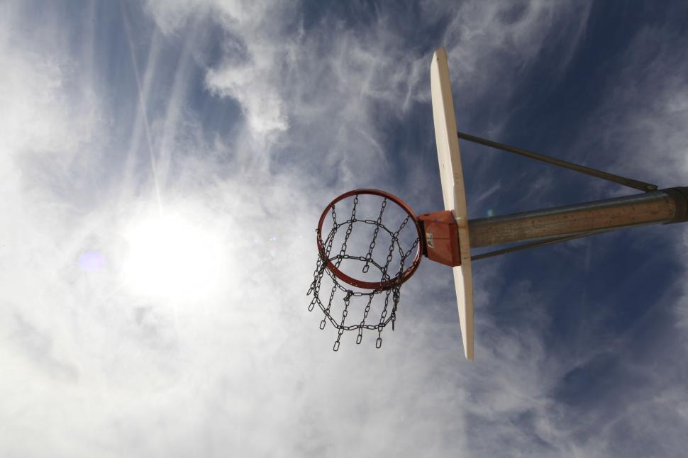 Free Image of Basketball hoop mounted on a pole with view of the sky 