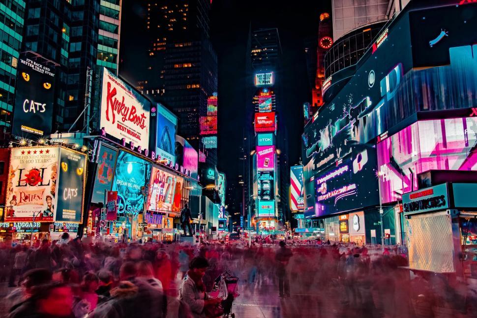Free Image of Vibrant Times Square at night with LED billboards glowing 