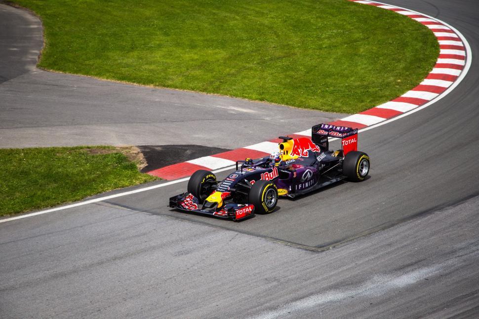 Free Image of Red Bull Formula 1 racing car speeds around the track. 