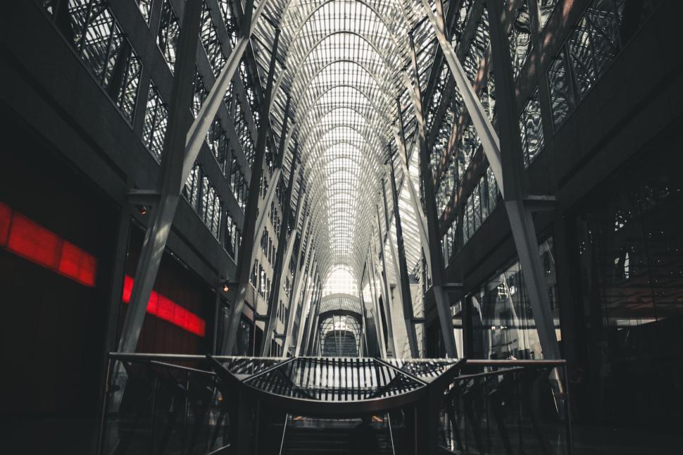 Free Image of Modern indoor atrium with intricate metal and glass architectural design. 