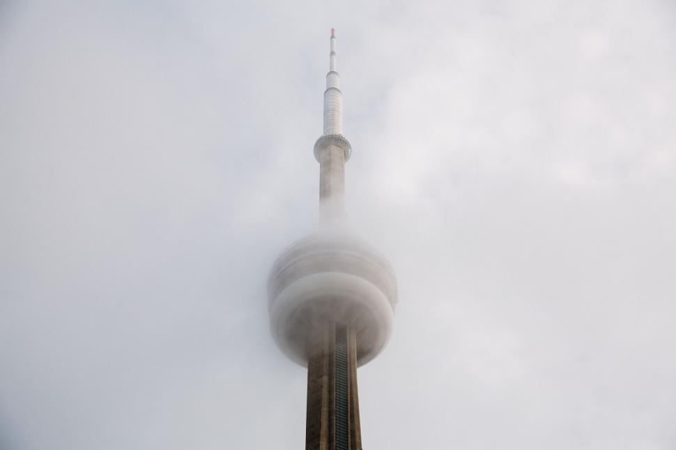 Free Image of Majestic tower piercing through the cloudy skyline in urban landscape. 