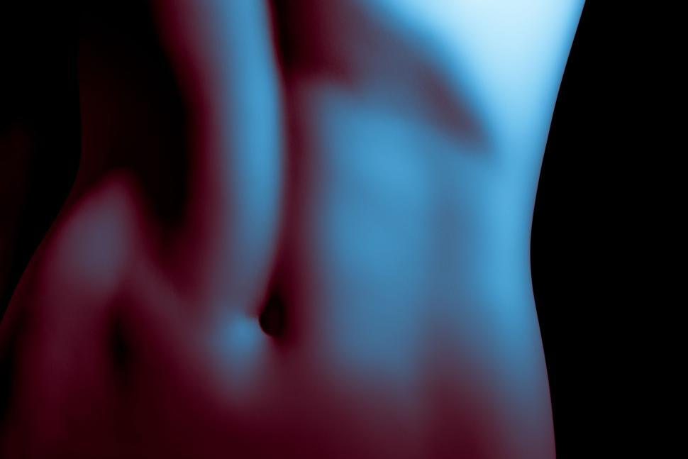 Free Image of Abstract blurred image with blue and red hues and undefined shapes 