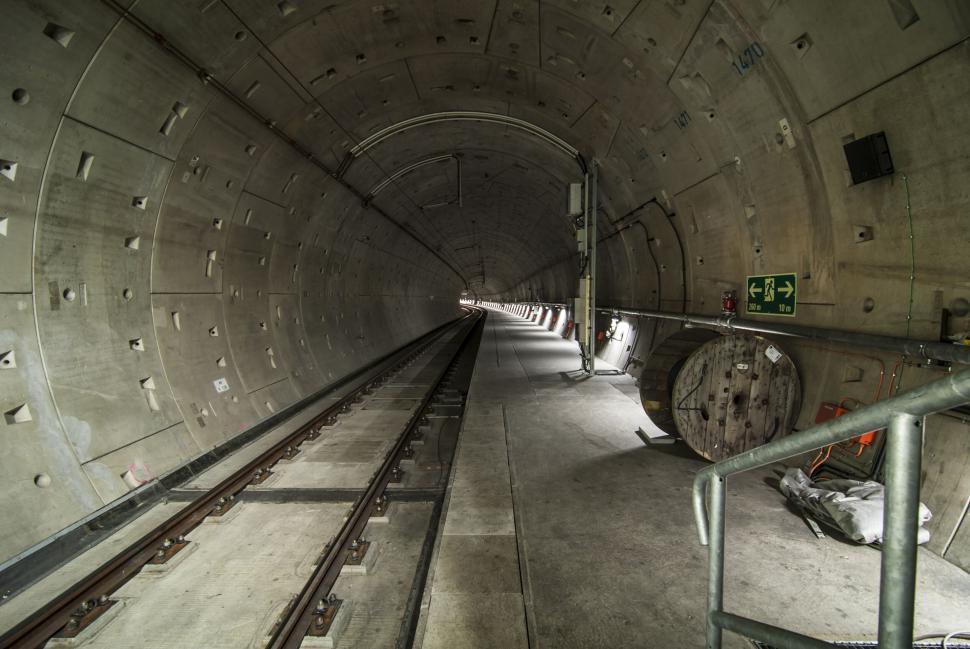 Free Image of Abandoned tunnel with railway tracks extending into the distance 