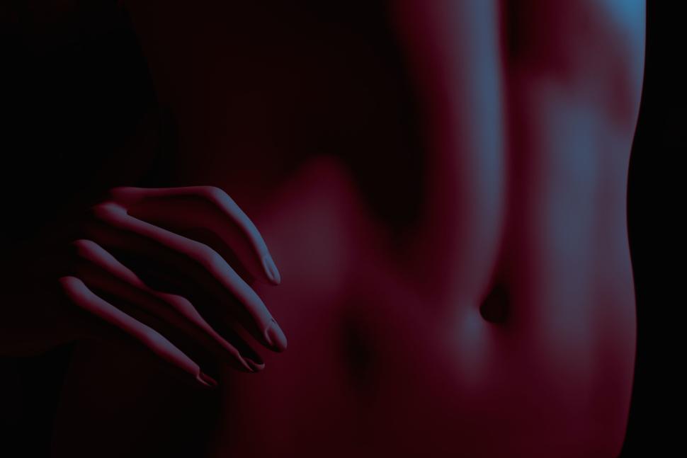 Free Image of Abstract artistic shot of a nude human form with dramatic lighting 