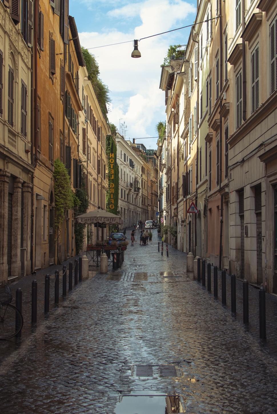 Free Image of Charming narrow cobblestone street in European city with old buildings 