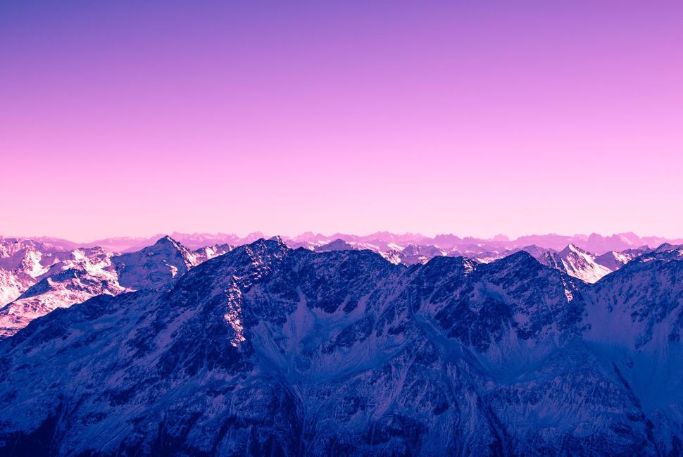 Free Image of Beautiful mountain range under a purple sky during sunset or sunrise. 