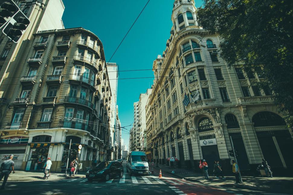 Free Image of Historic city street intersection surrounded by classic buildings daytime. 