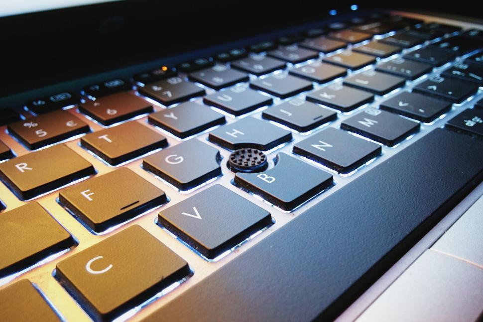 Free Image of Keyboard of a laptop computer glowing with backlight 