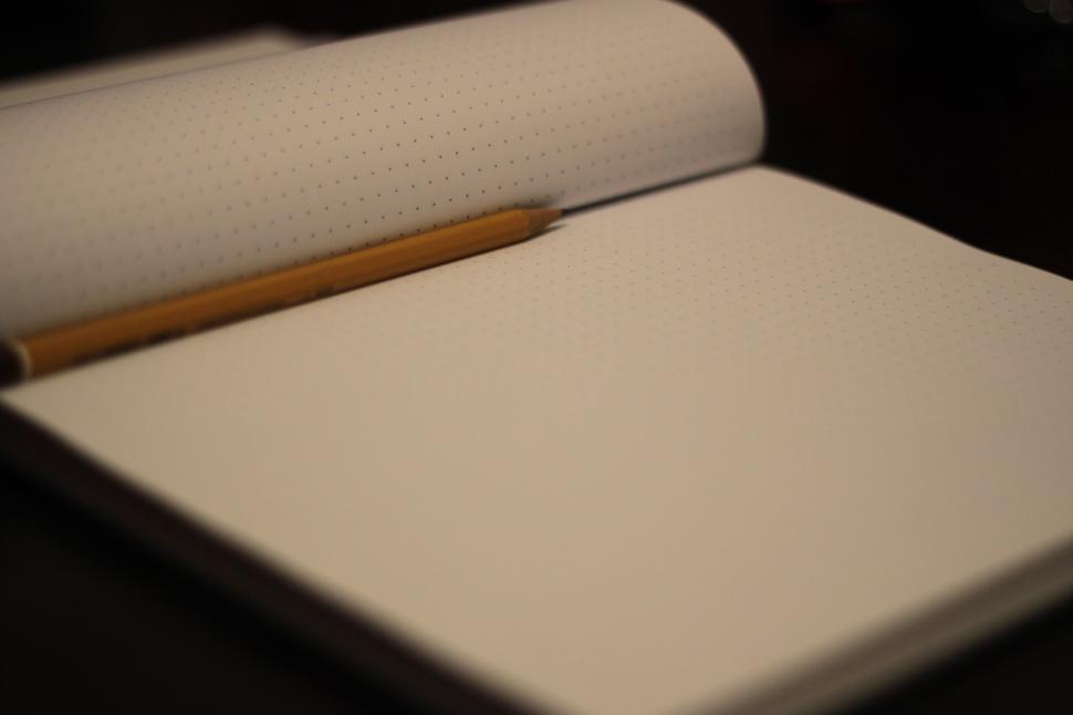 Free Image of Open dotted notebook with pencil ready for writing and ideas 