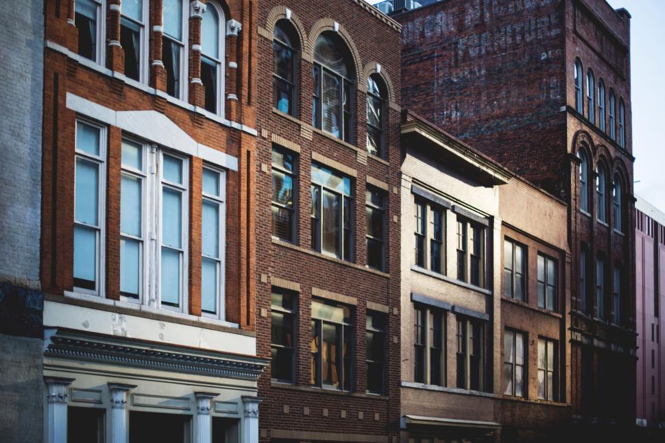 Free Image of Historic buildings with classic architecture on a city street 