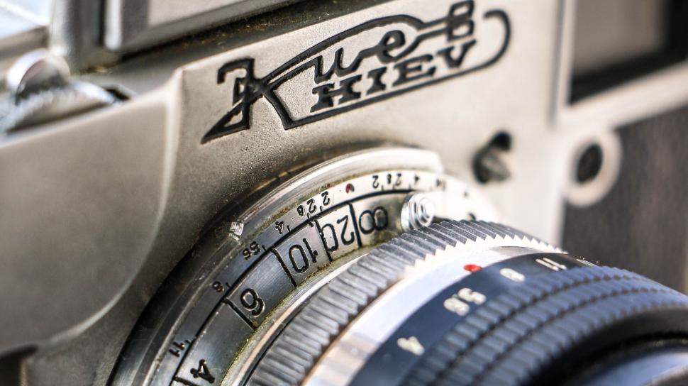 Free Image of Close-up detail of vintage Kiev camera displaying its Helios lens. 