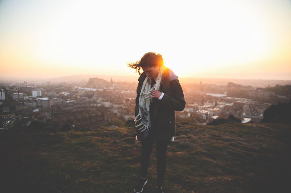 Free Image of Silhouetted person enjoying sunrise view from a high vantage point. 