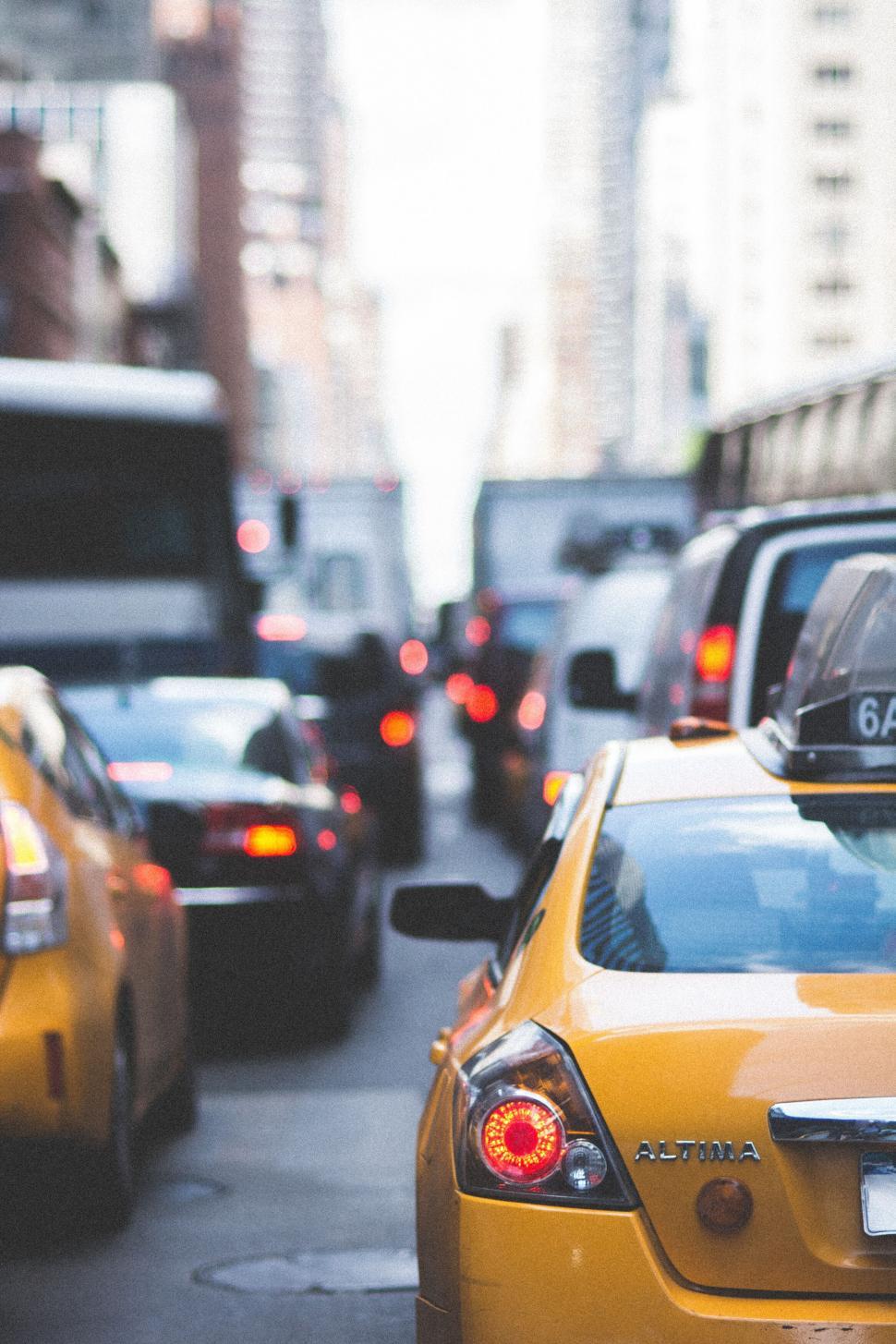 Free Image of Busy city street with yellow taxi cabs and dense traffic 
