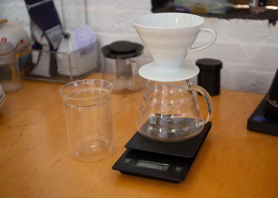 Free Image of Pour-over coffee setup with glass carafe and digital scale. 