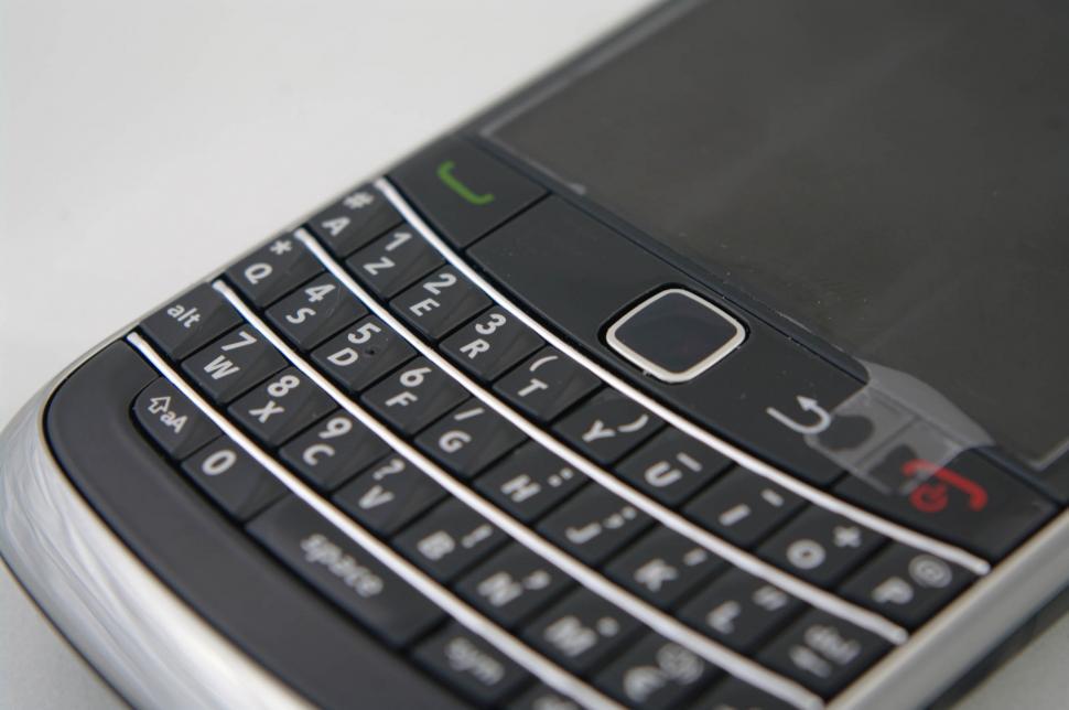 Free Image of Close Up of Cell Phone on White Surface 