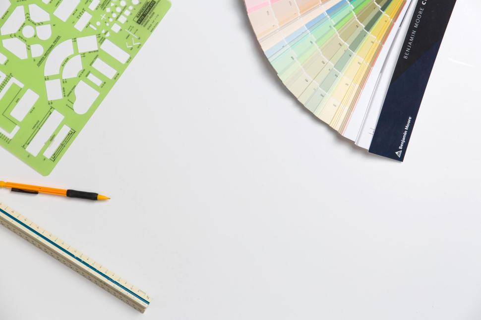 Free Image of Top view of architectural tools and color samples on white table 