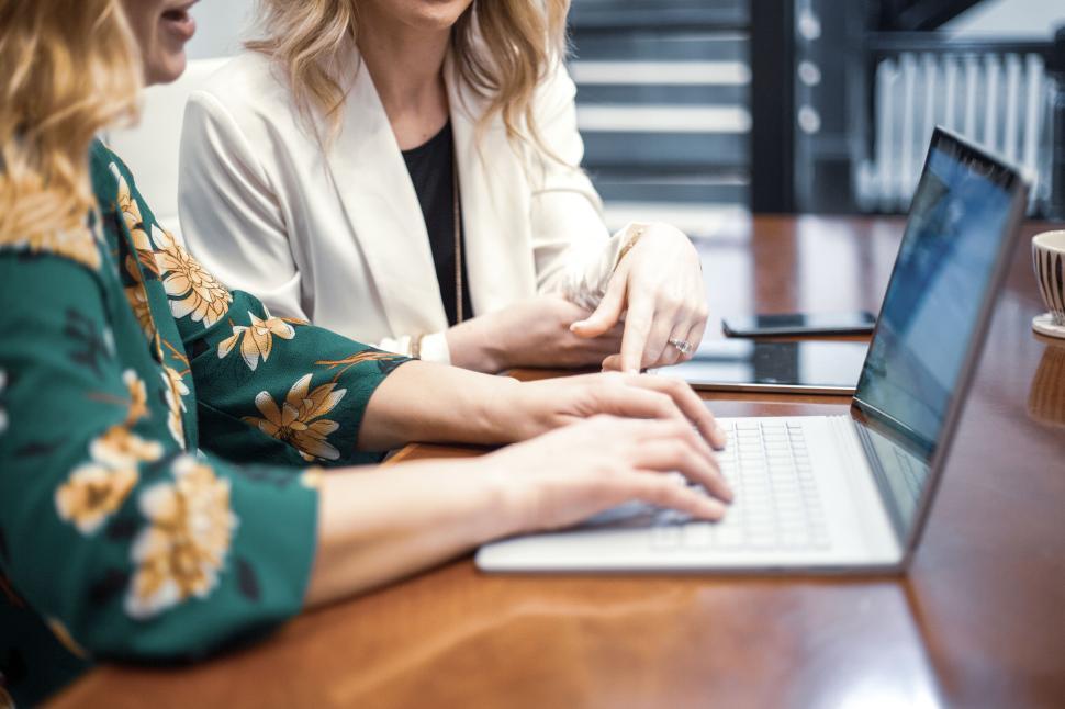 Free Image of Professional women engaging in a business discussion at the office. 