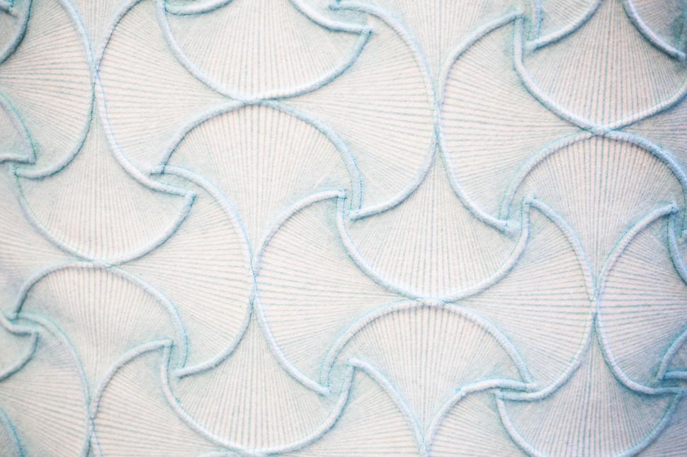 Free Image of Abstract blue and white pattern with intertwined circular shapes 