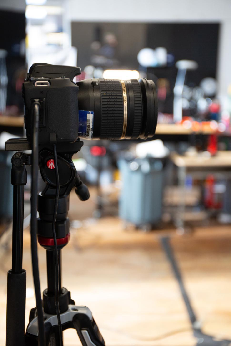 Free Image of Professional DSLR camera on tripod in a modern studio setting 