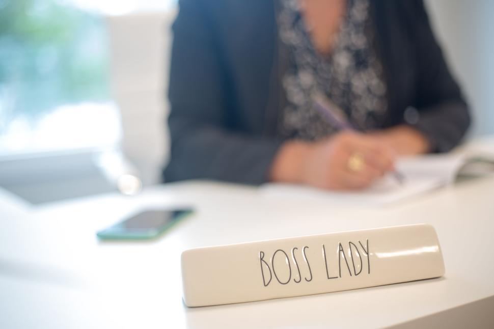Free Image of Boss Lady sign on desk of a professional woman in an office. 