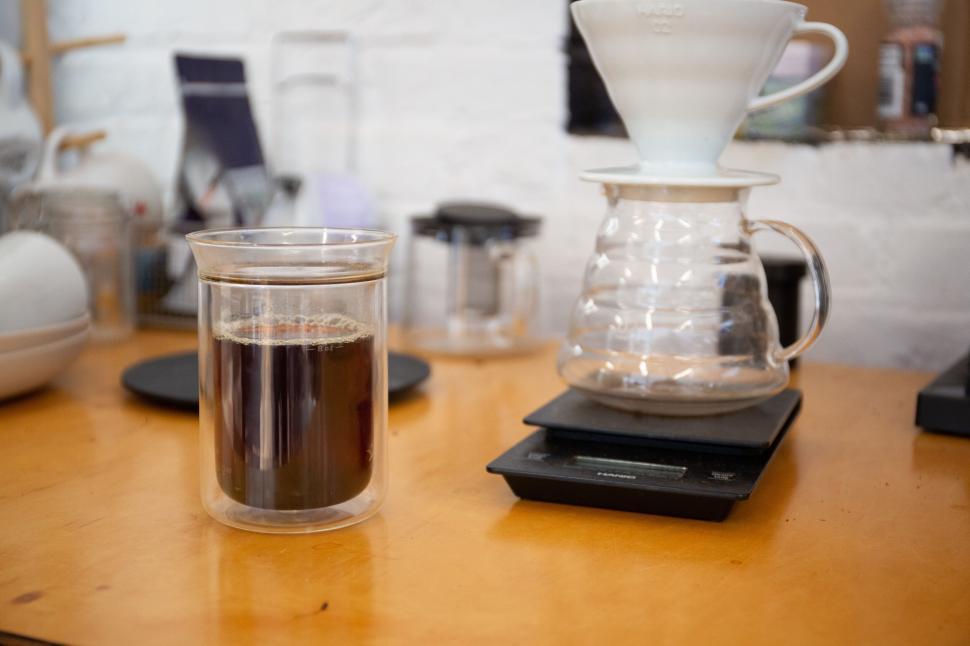 Free Image of Pour-over coffee setup with brewed coffee on a wooden table 