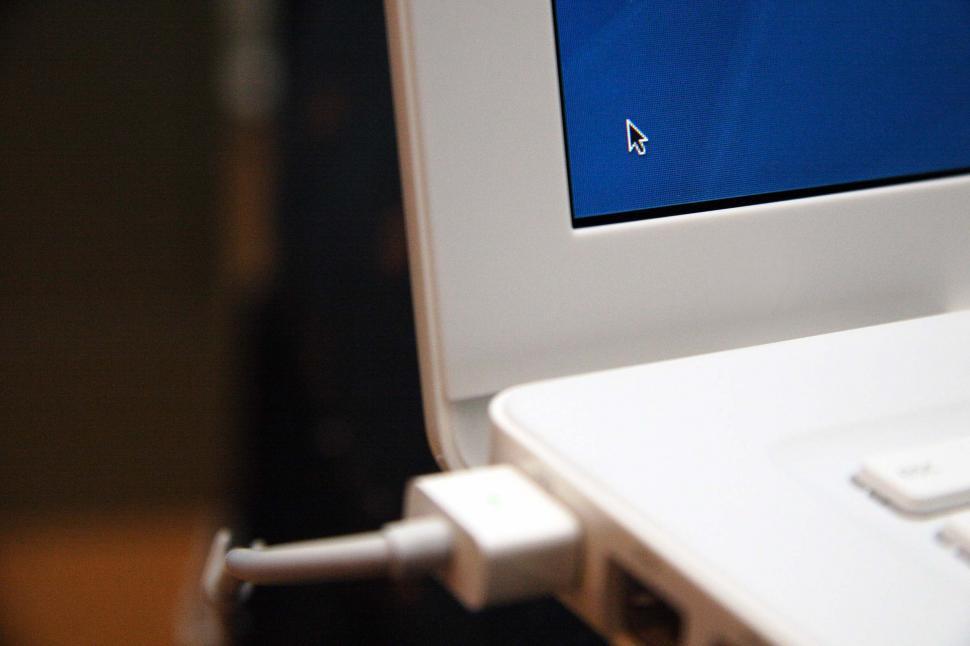 Free Image of Close Up of White Laptop With Blue Screen 