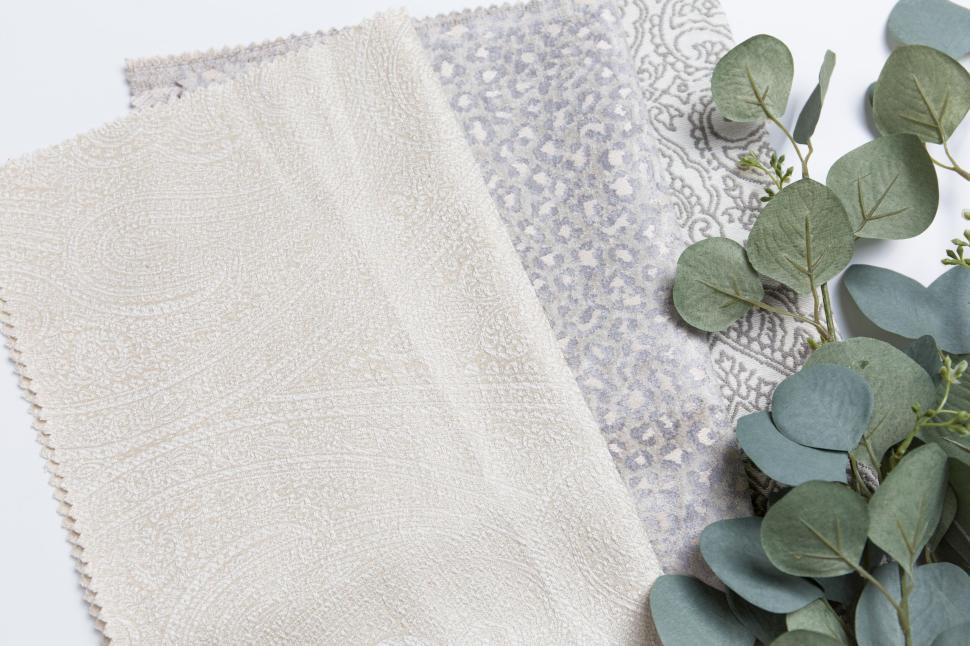 Free Image of Eucalyptus and patterned linen fabric swatches for home decoration 
