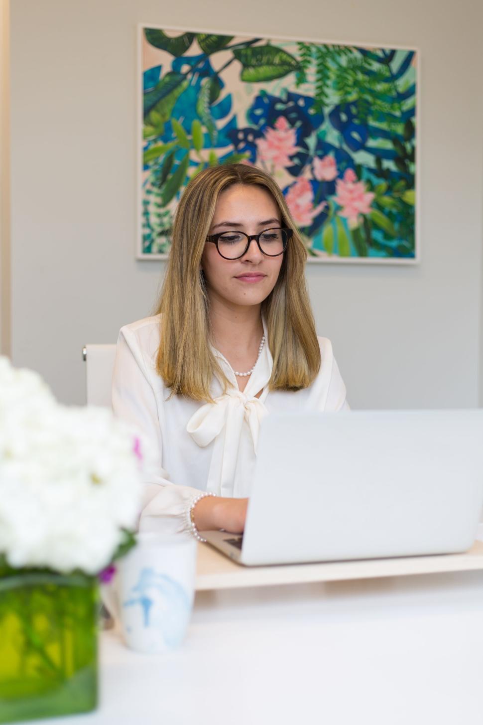 Free Image of Focused woman on laptop in modern office environment 