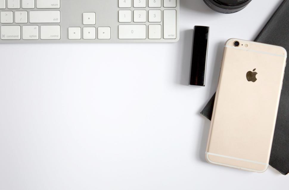 Free Image of Keyboard, smartphone and lipstick on a minimal white surface 