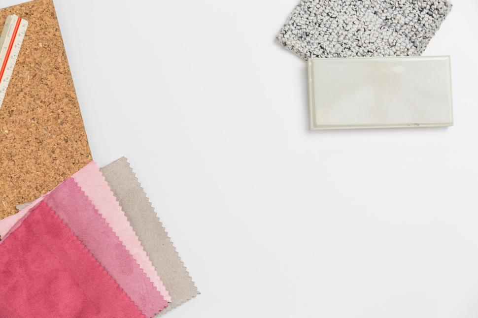 Free Image of Fabric and material samples displayed on a white surface. 