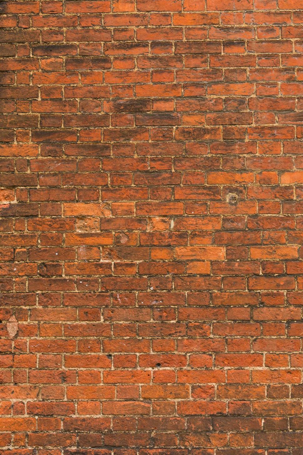 Free Image of Detailed texture of old red brick wall with weathered surface 