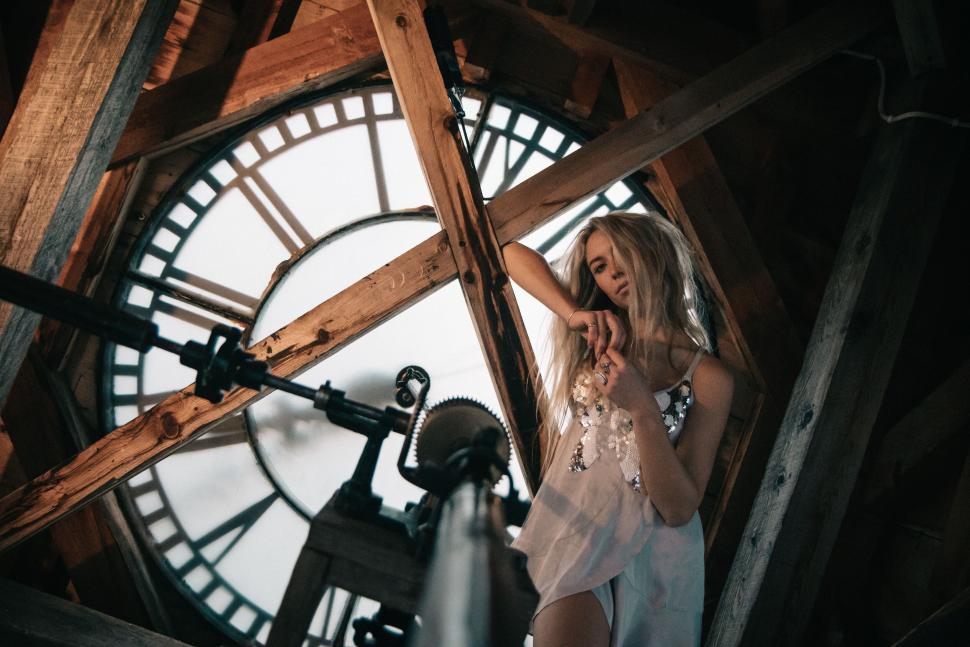 Free Image of Giant clock mechanism from the inside with wooden beams structure 