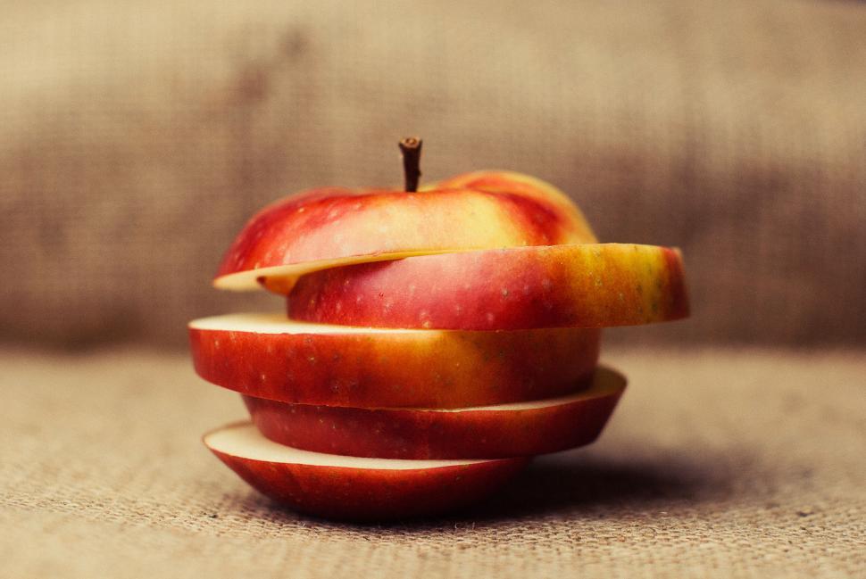 Free Image of Sliced apple reassembled, creating a unique layered look. 