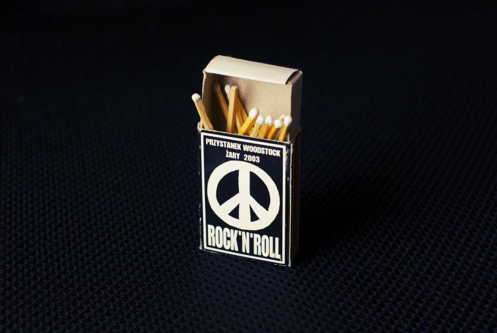 Free Image of Open matchbox with peace symbol, dates, and  Rock n Roll 
