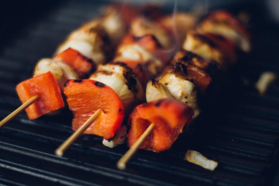 Free Image of Grilled vegetable and meat skewers with red peppers on a grill. 