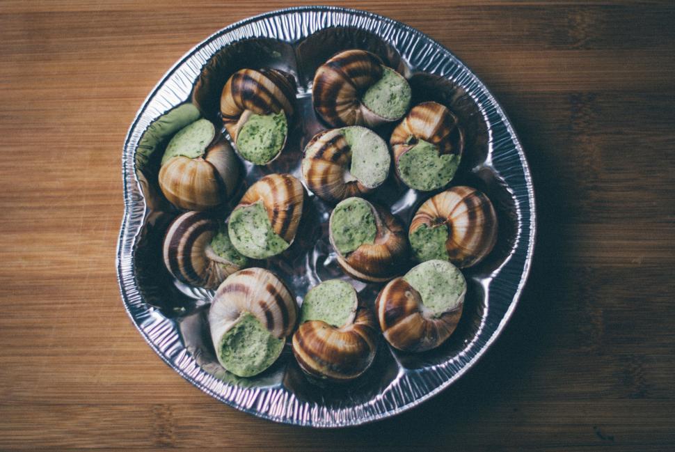 Free Image of Platter of escargot with herb butter ready for gourmet preparation. 