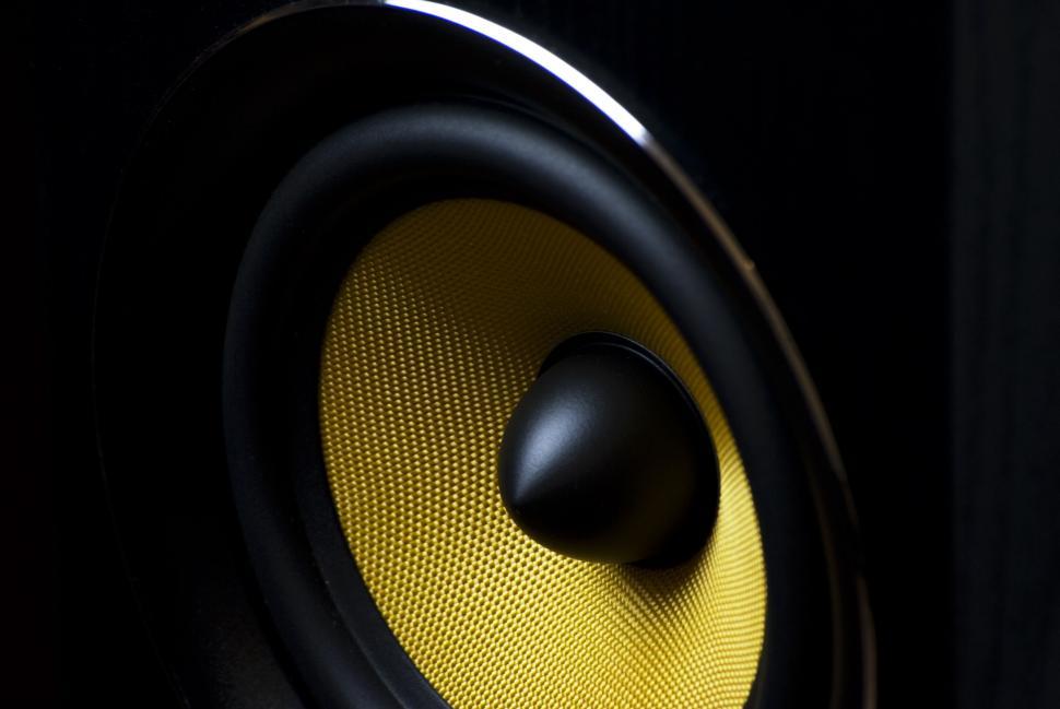 Free Image of Close-up view of a speaker cone with a black and yellow design. 
