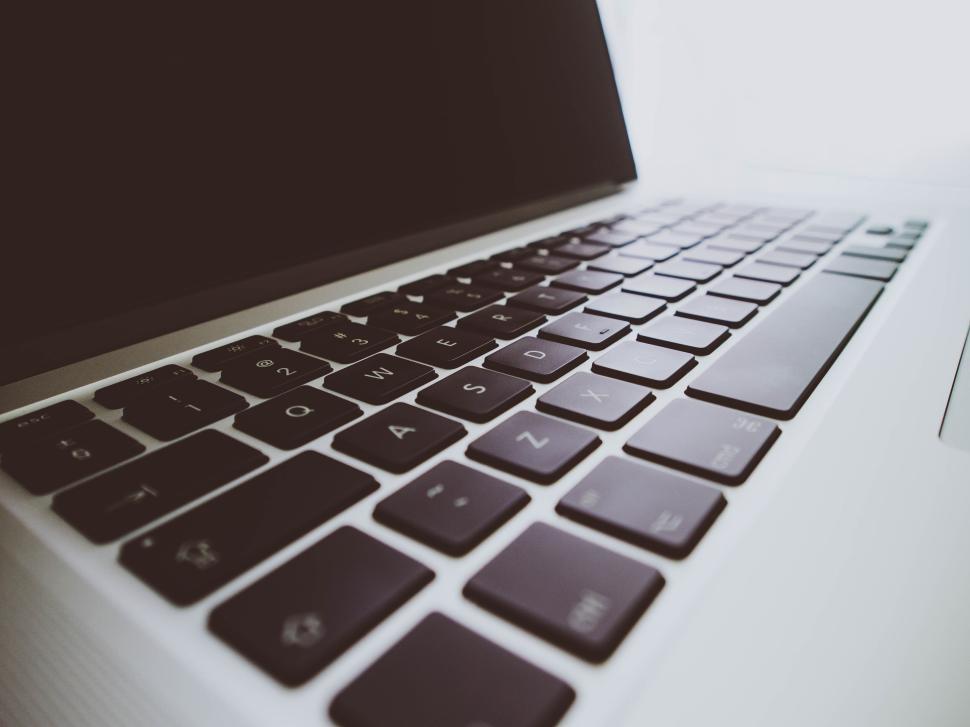 Free Image of Close-up view of a modern laptop keyboard with black keys. 
