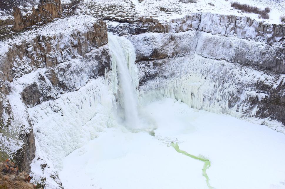 Free Image of Frozen waterfall in a snowy canyon on a winter day landscape shot 